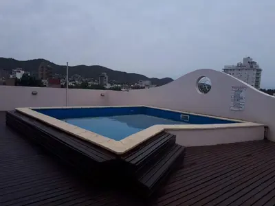 a swimming pool on the roof of a building at Dpto Centrico Carlos Paz in Villa Carlos Paz