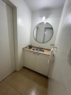 a bathroom with a sink and a mirror at MIRADOR Rest House in Bialet Massé