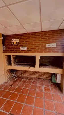 a brick wall with two shelves in a room at MIRADOR Rest House in Bialet Massé