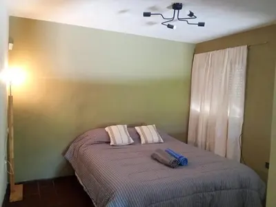 a bedroom with a bed with two towels on it at Moderno PH, céntrico y económico, muy comodo, cocina, wifi, cochera techada privada in Cordoba