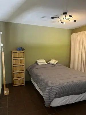 a bedroom with a bed and a ceiling fan at Moderno PH, céntrico y económico, muy comodo, cocina, wifi, cochera techada privada in Cordoba