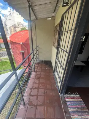 an empty hallway of a building with a balcony at Moderno PH, céntrico y económico, muy comodo, cocina, wifi, cochera techada privada in Cordoba