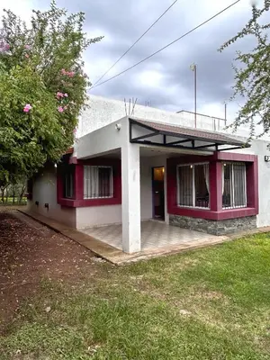 a small house with a red and white at Departamento Cerro Overo in Merlo