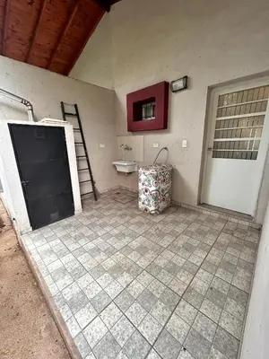 a room with a door and a sink in a room at Departamento Cerro Overo in Merlo