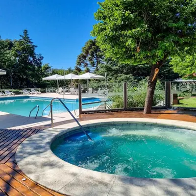 a large swimming pool with aicrobialicrobialicrobialicrobialicrobial at Berna Hotel & Spa in Villa General Belgrano