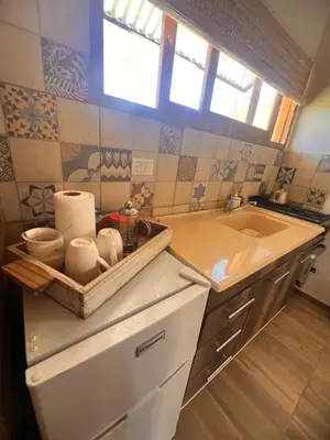 a kitchen with a sink and a counter top at Ranchos de la Tata in Las Calles