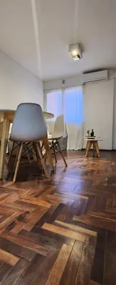 a room with a table and a chair and a table at Departamento en Nueva Cordoba in Cordoba