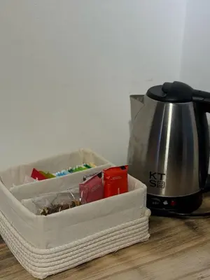 a container sitting on a table next to a blender at Departamento en Nueva Cordoba in Cordoba