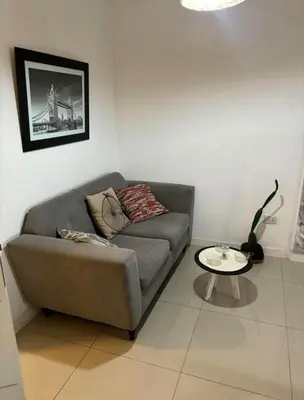 a living room with a couch and a table at Departamento en general Paz a pocas cuadras del panal in Cordoba