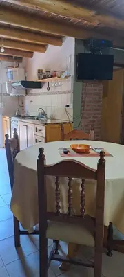 a kitchen with a table with a bowl on it at TIERRA SERRANA CABAÑAS s in Villa Anizacate