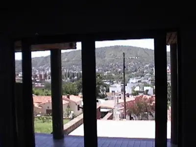 a view of a city from a window at Confortable Carlos Paz Céntrico 4 personas Estac Interno in Villa Carlos Paz