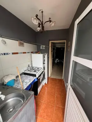 a kitchen with a sink and a stove at Monoambiente NONA in Villa Cura Brochero