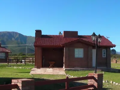 a small brick house with a red roof at Brisa de los Molles in Los Molles