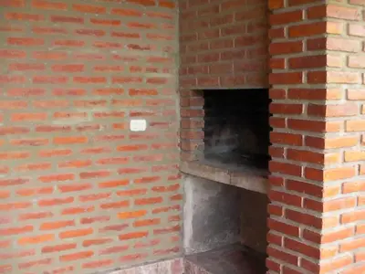 an empty brick oven in a brick wall at Brisa de los Molles in Los Molles
