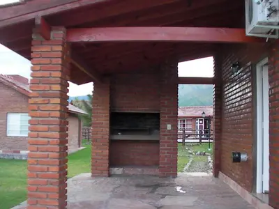 a brick patio with an outdoor oven in a house at Brisa de los Molles in Los Molles