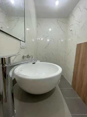 a white sink in a bathroom with a mirror at NueveSesenta Loft in Cordoba
