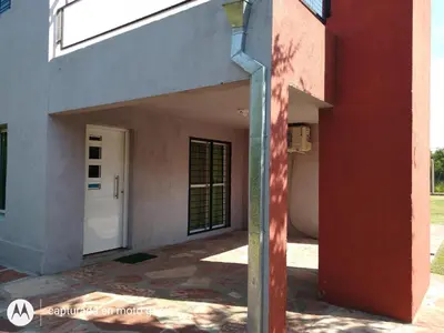 an entrance to a building with a white door at Cabaña Sombra Lunar en Cabañas Encuentro in Carpintería