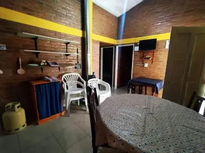 a dining room with a table and chairs in a room at Alojamiento temporal mis seis soles in Villa de Las Rosas