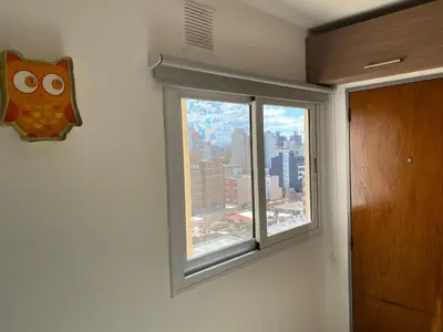a window in a room with a view of a city at Departamento temporario Colon y Fragueiro in Cordoba