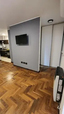 a room with a flat screen tv on a wall at Departamento -Buenos Aires- Pleno Nueva Cordoba By Apartcba in Cordoba