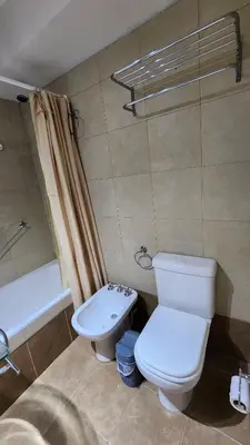 a bathroom with a toilet and a sink and a tub at Departamento -Buenos Aires- Pleno Nueva Cordoba By Apartcba in Cordoba