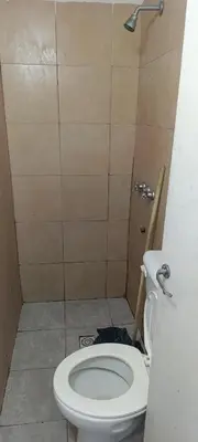a small bathroom with a toilet and a shower at Celeste departamento in Cordoba