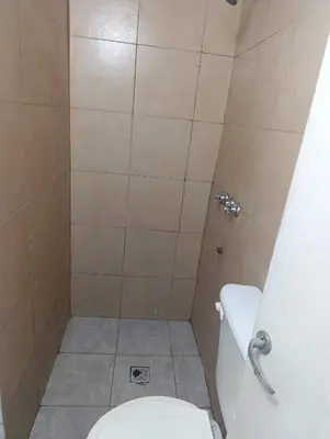 a bathroom with a toilet and a shower at Celeste departamento in Cordoba
