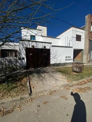 a shadow of a person standing in front of a building at La moora in Alta Gracia