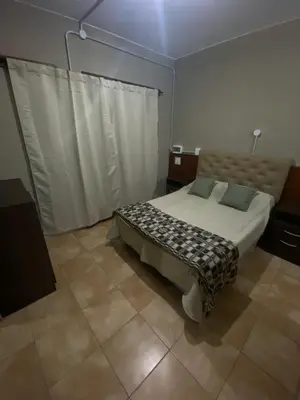 a bedroom with a bed in a room at La moora in Alta Gracia