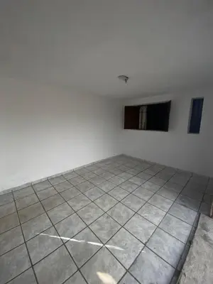 an empty room with white walls and a tile floor at La moora in Alta Gracia