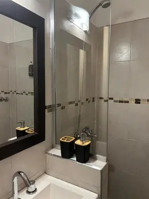 a bathroom with two sinks and a shower at Casa Frida - Alojamiento exclusivo para Mujeres - in Villa Carlos Paz