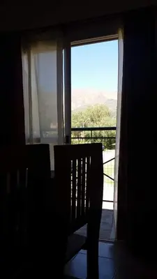 a silhouette of a chair in front of a window at Los Damascos in Merlo