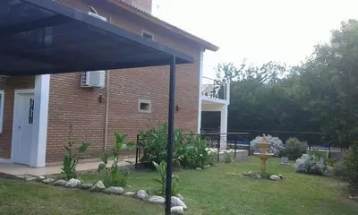 a view of a house with a pergola at Los Damascos in Merlo
