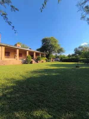 a house with a large lawn in front of it at Los Condores in La Bolsa