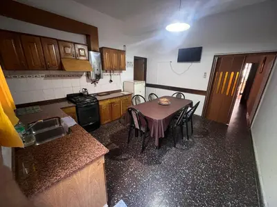 a small kitchen with a table and chairs in it at Luluara in Villa Carlos Paz