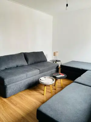 a living room with a couch and a table at AMOBLADOS CORDOBA - Centro Histórico in Cordoba
