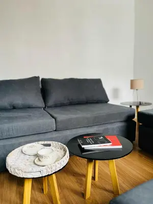 a living room with a couch and two coffee tables at AMOBLADOS CORDOBA - Centro Histórico in Cordoba