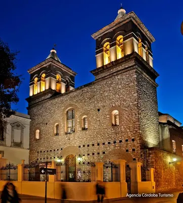 a large building with a tower on top of it at AMOBLADOS CORDOBA - Centro Histórico in Cordoba