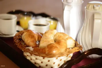 a basket of bread sitting on a table at Posada de las Sierras in Merlo