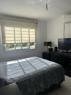 a bedroom with a bed and a flat screen tv at Amanecer eterno in Cordoba