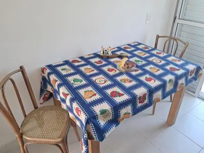 a table with a blue and white quilt on it at Departamento para 2 personas in Alta Gracia