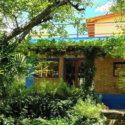 a brick house with plants on the side of it at La Casa Azul in San Javier