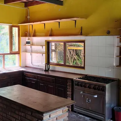 a kitchen with a stove and a counter top at La Casa Azul in San Javier