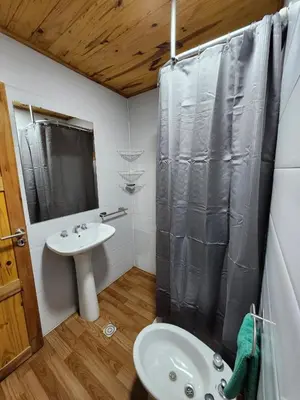 a bathroom with a sink and a shower at Rincon Soñado in La Porteña