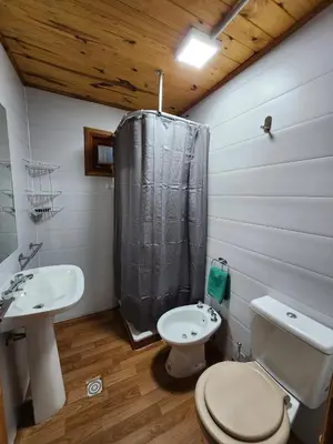 a bathroom with a toilet and a sink at Rincon Soñado in La Porteña