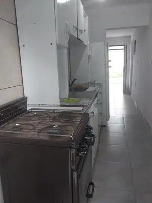 a kitchen with a stove and a counter top at Mate host 2 in Cordoba