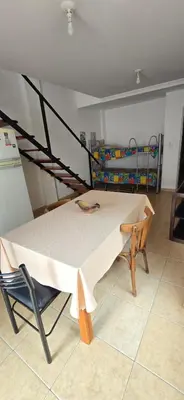 a bed in a room with a bunk bed at La Martina in Villa Carlos Paz