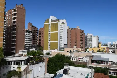 a view of a city skyline with tall buildings at Departamento Abril in Cordoba
