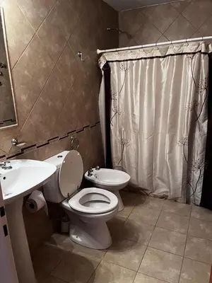 a bathroom with a toilet and a sink at Cabañas Paz in Carpintería