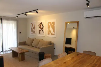 a living room with a couch and a table at Faz Flat in Cordoba